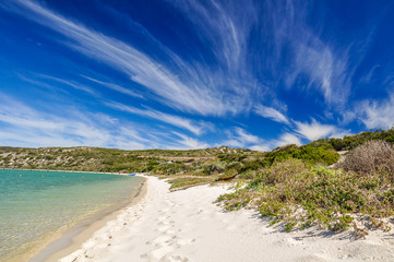 Stunning view of Langebaan Lagoon in West Coast National Park,120 km north of Cape Town, Western Cape Province, South Africa. Sunny day, white beach and mountains in the background. 