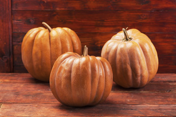 Autumn Pumpkin Thanksgiving Background . Orange pumpkins over wooden board