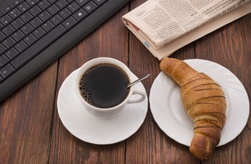 breakfast with cup of black coffee, croissants