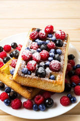 Homemade breakfast  Belgian waffles with blueberry and raspberry
