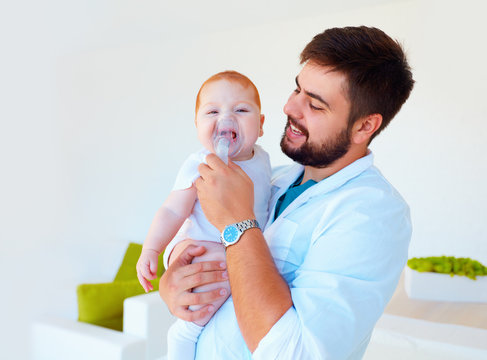 Infant Baby Receives A Nebulizer Treatment Through The Facial Mask