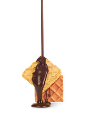 pouring chocolate on waffle cookies isolated on white background