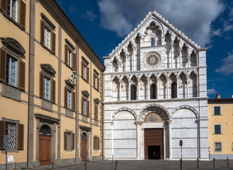 Fototapeta na wymiar 14th century Gothic white and gray marble facade of the Santa Caterina d'Alessandria church in Pisa, Italy