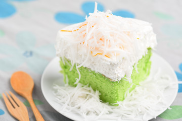 Green pandan cake and fresh cream with coconut on top