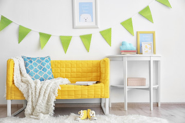 Modern room interior with yellow sofa