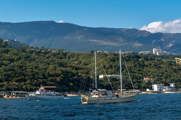 The yacht and boat floats in the Black Sea