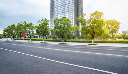 Fototapeta na wymiar Empty asphalt road through modern city in Shanghai,China.