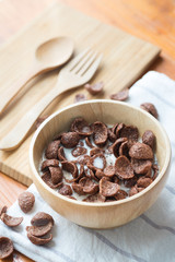 Bowl of chocolate flakes with milk for breakfast