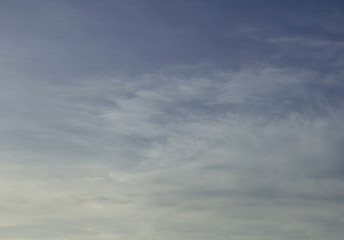 blue sky background with tiny clouds