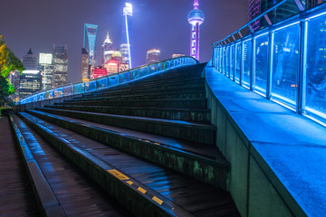 Stairs with cityscape in background at night in Shanghai,China.