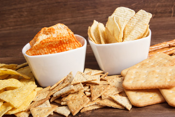 Heap of salted crisps and cookies, concept of unhealthy food