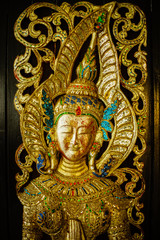 Fototapeta na wymiar Traditional Thai Art on Temple door