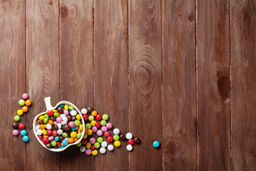 Colorful candies over wood