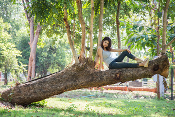 The women is on a tree.