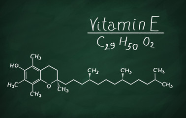 Structural model of Vitamin E (tocopherol) on the blackboard.