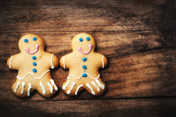 ..Christmas homemade gingerbread man cookie on wooden table. Chr