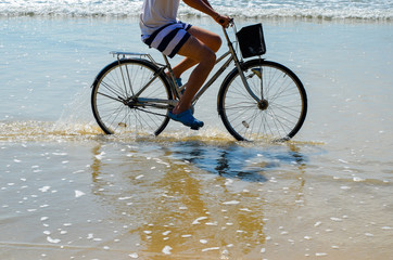 Fototapeta premium Bike ride on the beach