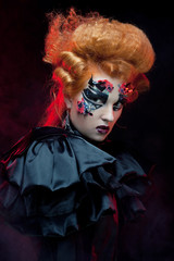 Gothic redhair witch. Dark woman. Halloween picture.