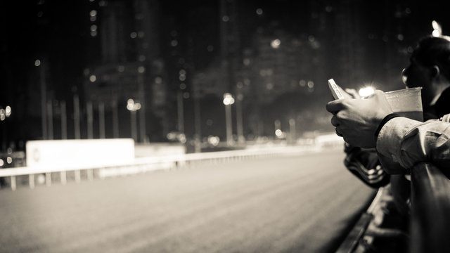 Crowd At Horse Race Course Edge Cheering, Taking Photo And Prepa