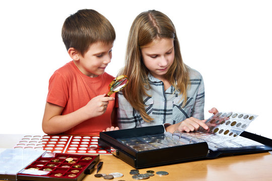 Boy and girl are considering coin collection isolated