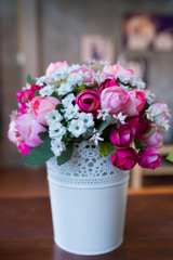 Fake flower on wood table