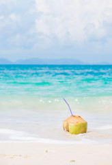 fresh coconut cocktail on tropical beach