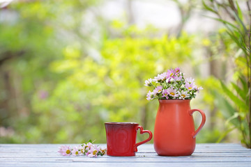 flower in red pot with red cup