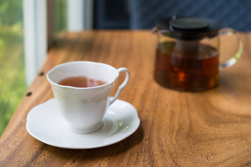 Cup of tea on wooden table. shallow depth of field