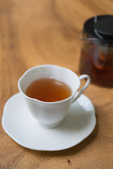 Cup of tea on wooden table. shallow depth of field