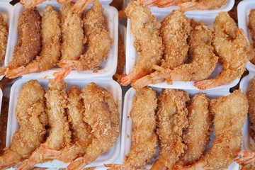 fried shrimp in styrofoam plate