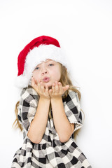 Happy christmas girl in Santa hat on white background
