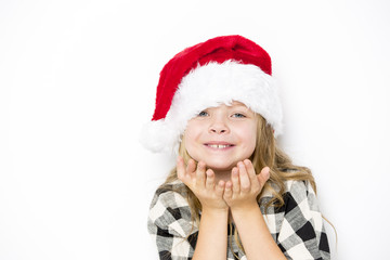Happy christmas girl in Santa hat on white background