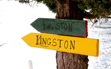 Tourist sign Kingston on wood