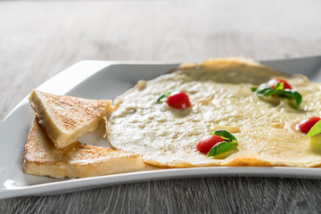 English Omelette with Tomatoes on Table