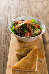 Fresh breakfast Omelette Salad with Parma Ham, feta cheese and vegetables.