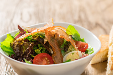 Fresh breakfast Omelette Salad with Parma Ham, feta cheese and vegetables.