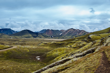 Valley National Park Landmannalaugar. On the gentle slopes of the mountains are snow fields and glaciers. Magnificent Iceland in the August