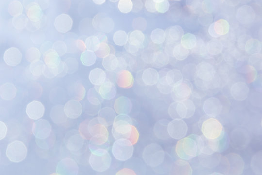 Bokeh soft pastel serenity background with blurred rainbow  lights. Festive background.