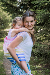 Fototapeta premium walk mom and daughter in the woods