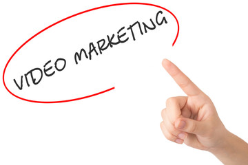 Hand of a young girl points to a word