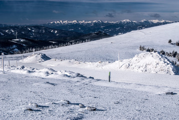 winter austrian Alps panorama with Seckau Tauern and Ennstal Alps from Pretulalpe hill in Fischbacher Alpen mountains in Styria