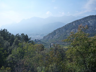 misty view at lago di garda mountains