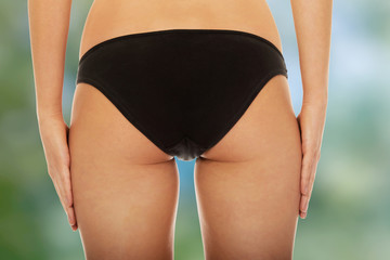 Woman's back in underwear.