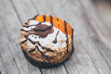 sweet autumn cake on wooden board