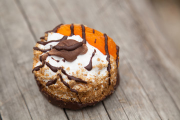sweet autumn cake on wooden board