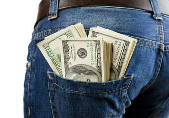 Bunch of bills in the pocket of jeans

