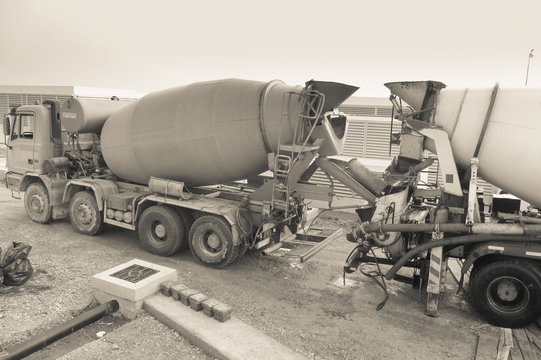 two cement mixers on construction site