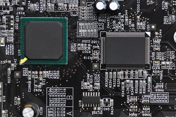 Printed circuit board with microchips and other electronic components. Computer  networking communication technology concept. Toned image.