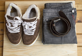 brown shoes worn on the background of wood