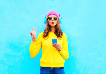 Fashion pretty sweet carefree woman listening music in headphone